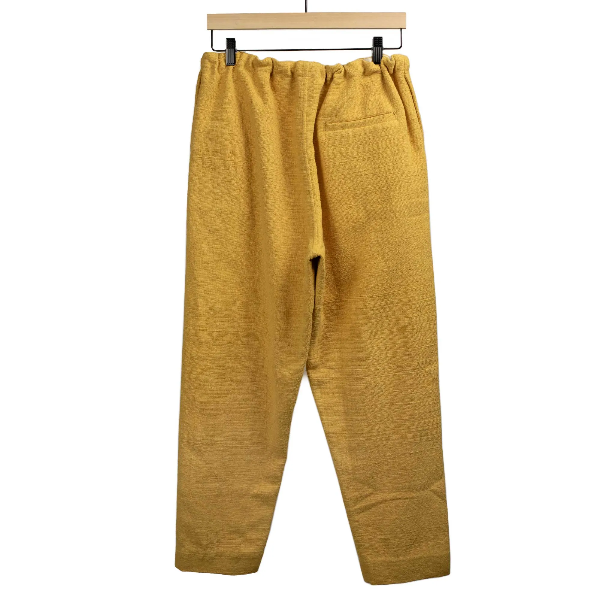 Drawstring tapered trousers in mango yellow cotton basketweave